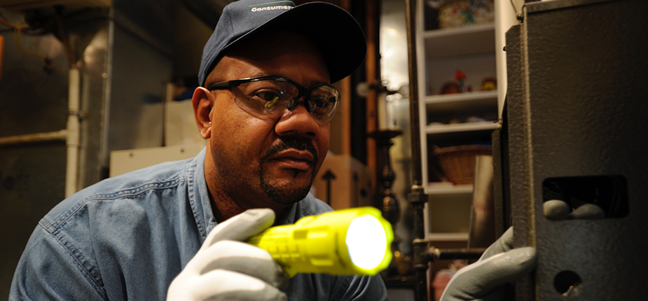 Consumers energy worker performing a Home Energy Analysis